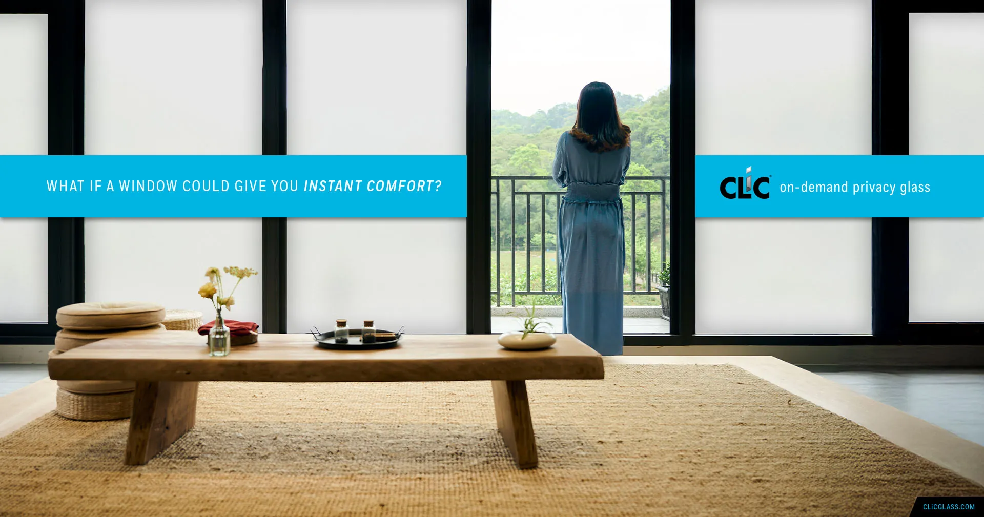 Woman looking out through CLiC privacy glass — what if a window could give you instant comfort?