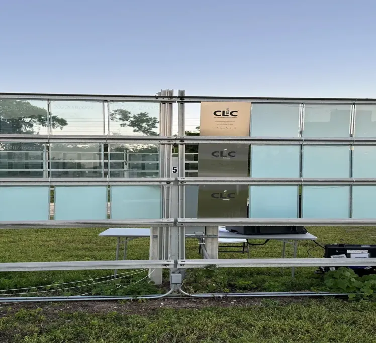 Cardinal quality control technician inspecting glass on the production line